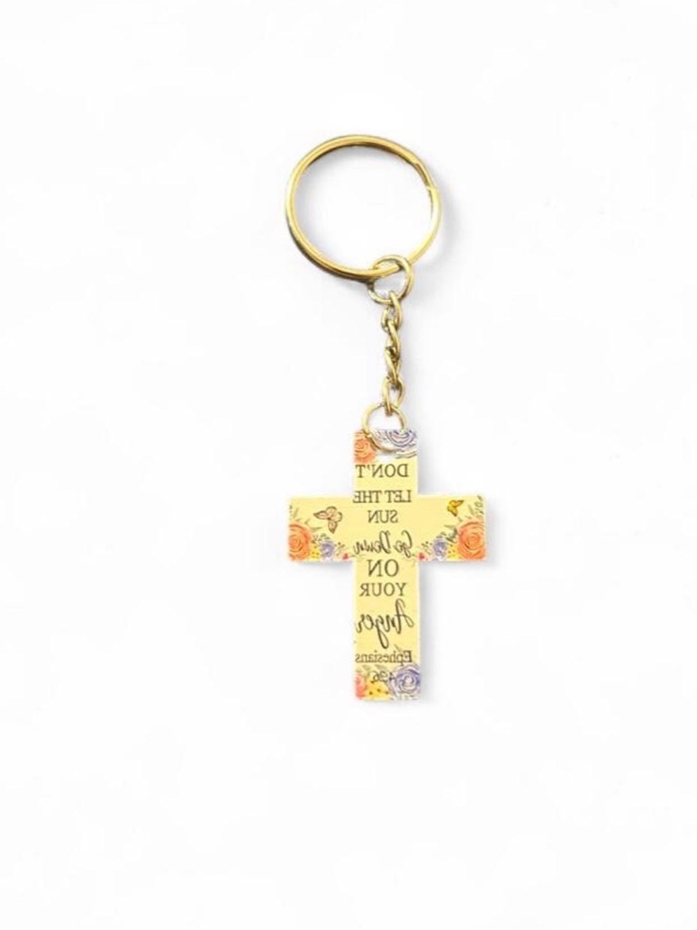 Cross keychain with the words 'DON'T LET THE SUN Go Down ON YOUR Angels